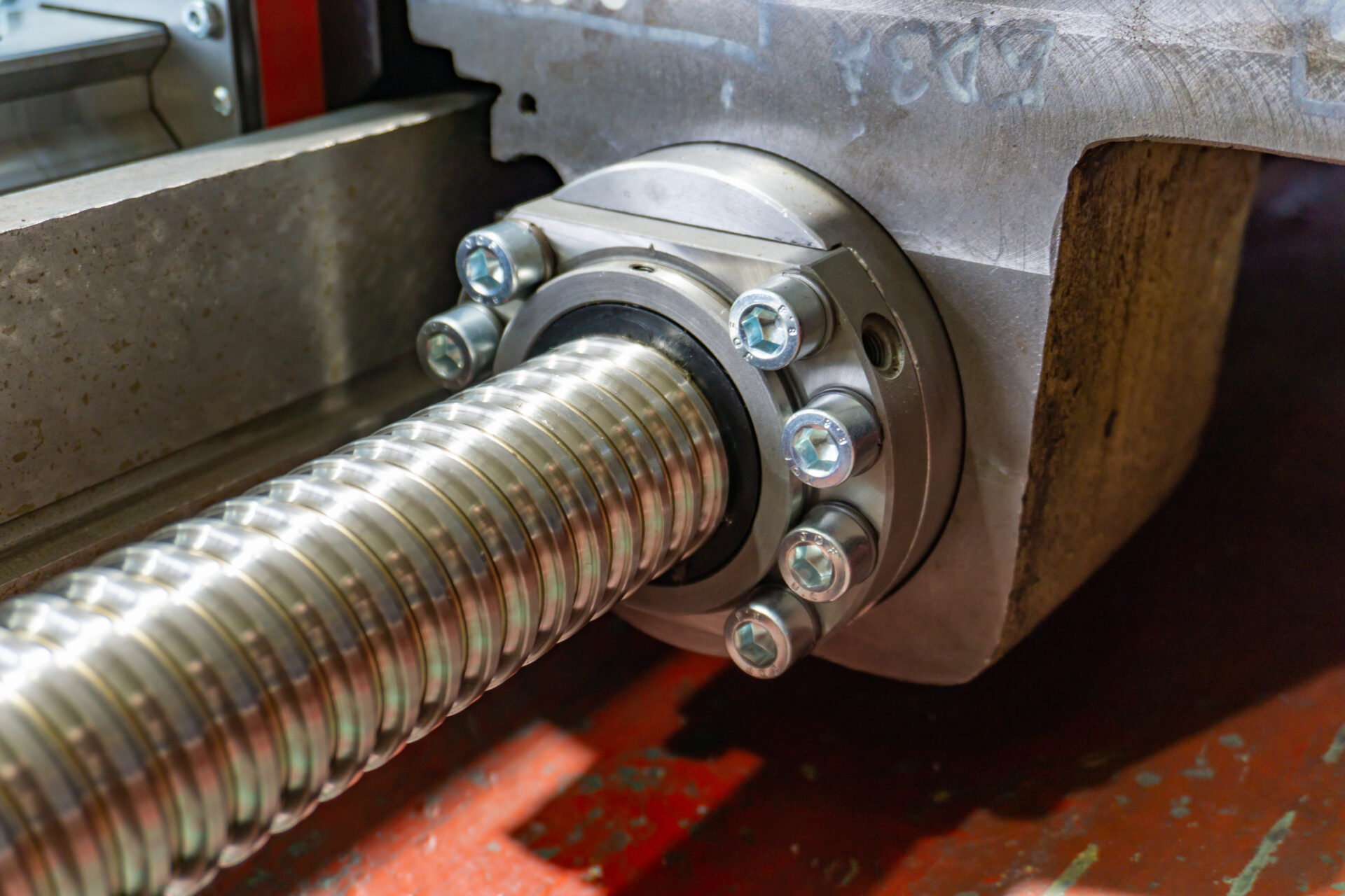 Ball screw for transferring the caliper into motion and feeding